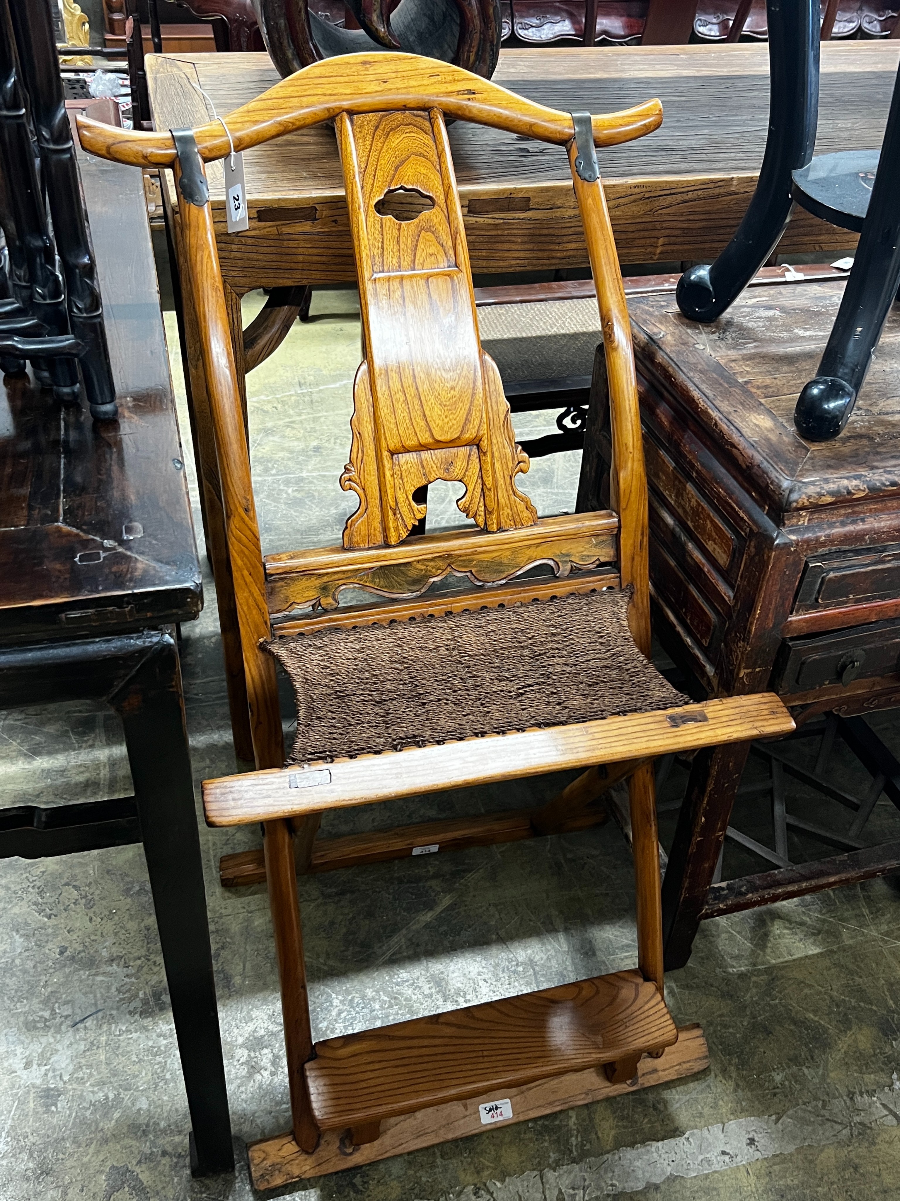 A Chinese elm folding hunting chair, height 105cm